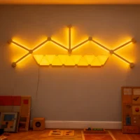 RGBIC mini triangle wall light kit with LED bars for gaming rooms, streaming setups, and immersive home décor by Gaming Hexagon Lights